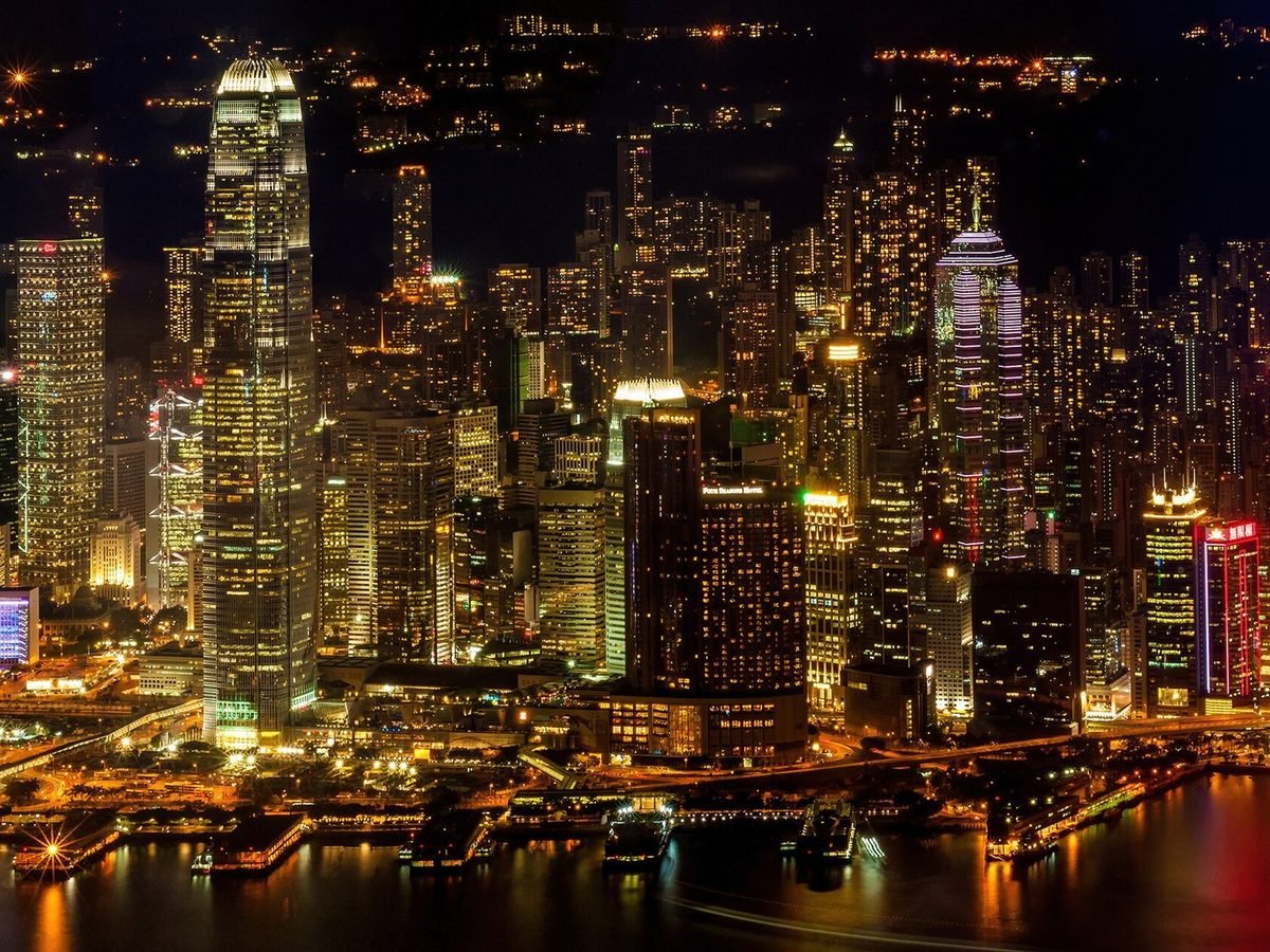 Hong Kong's illuminated skyline across Victoria Harbour at night