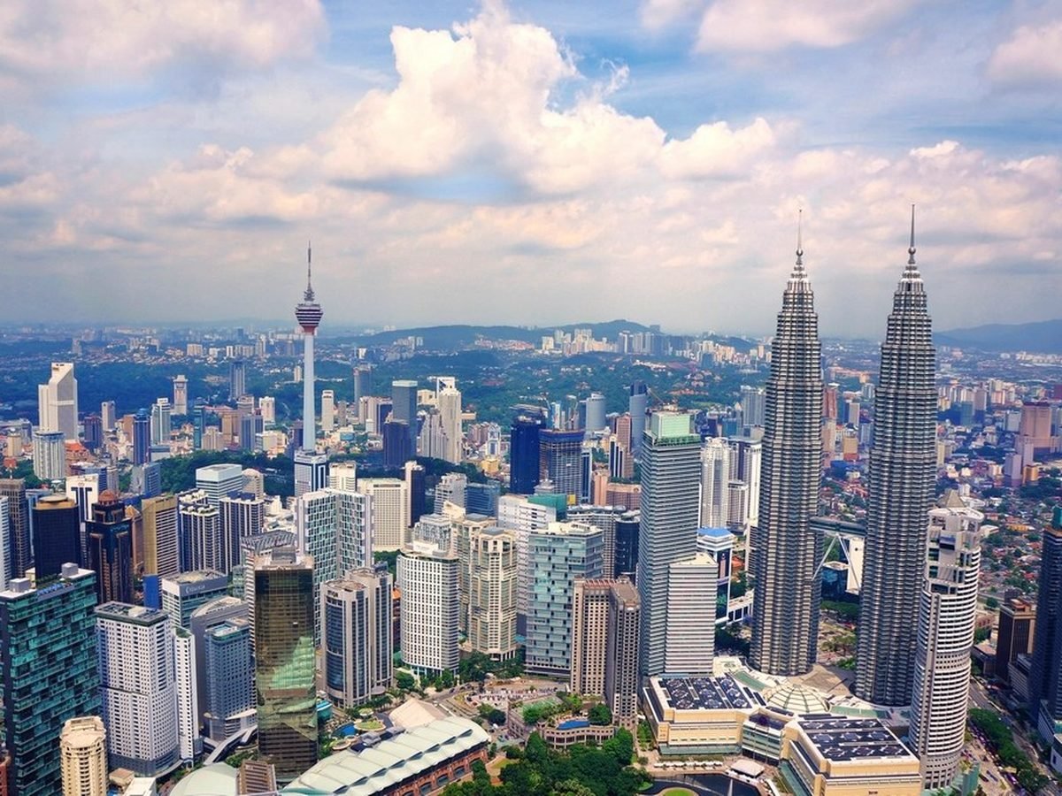 Kuala Lumpur's skyline with the Petronas Towers and KL Tower above the city