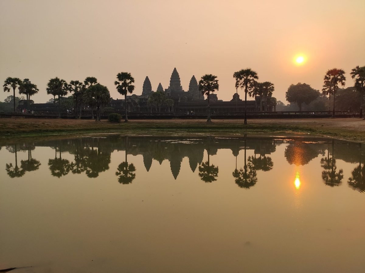 Angkor Wat at sunrise reflected in the temple pond in Cambodia